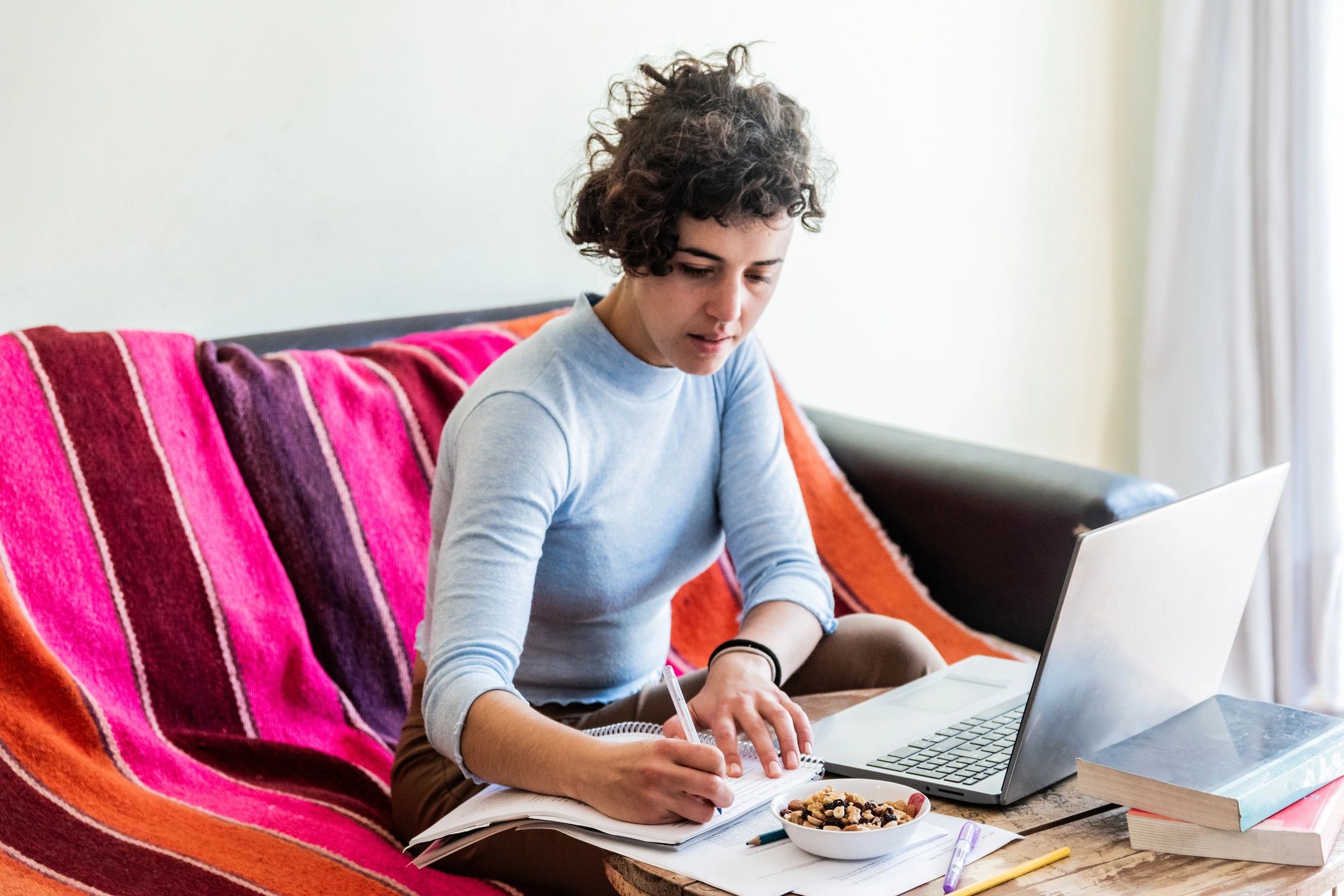 Reader working from home with a laptop